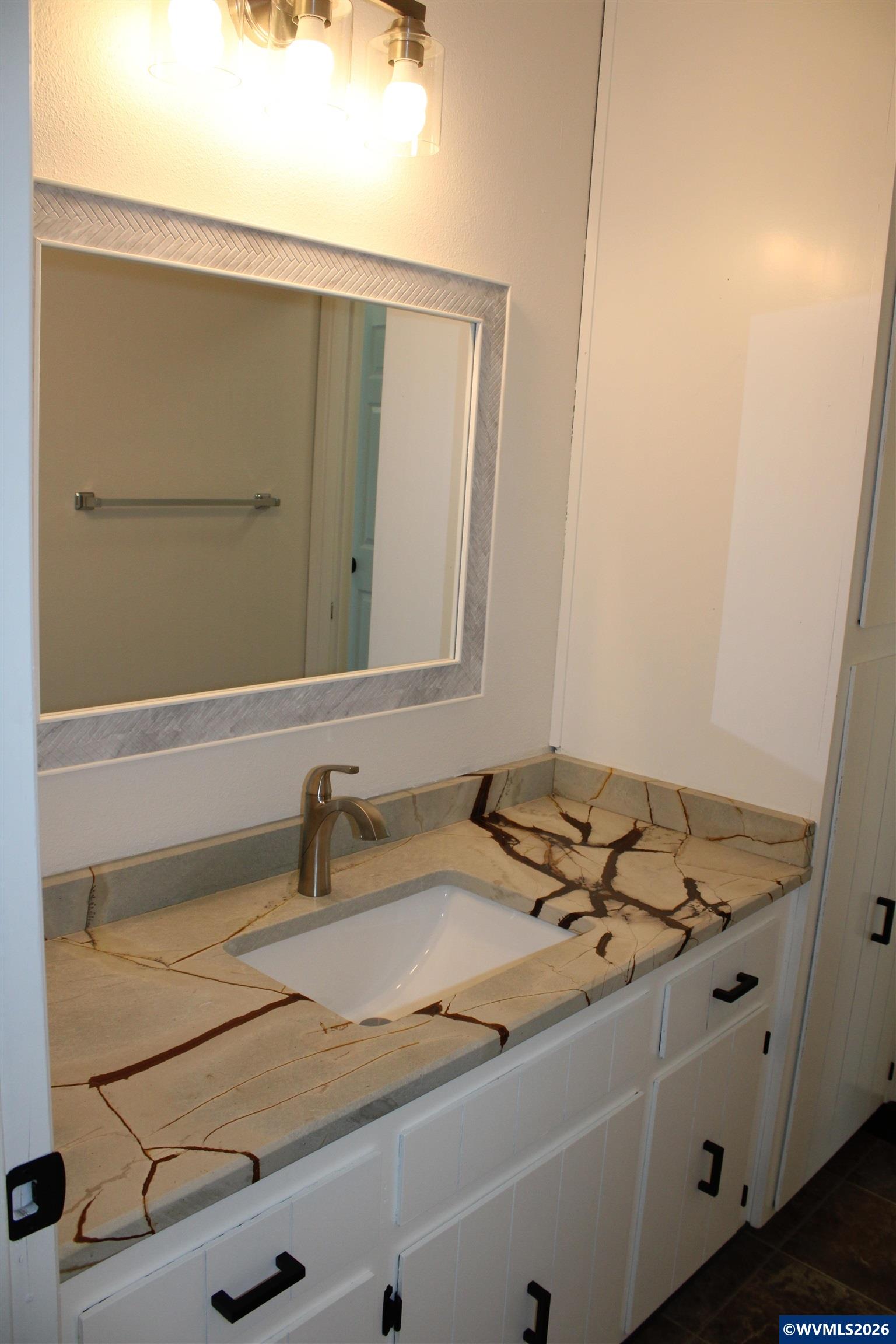 6259 Chapman Place Southwest Albany, OR 97321 - Photo 11 of 21 a bathroom with a sink and a mirror