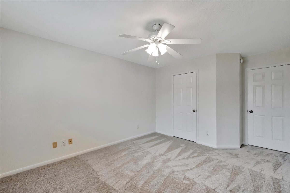 14010 Hazel Ridge Court Houston, TX 77062 - Photo 27 of 38 Bedroom #2 facing the exit door (right) and the closet door.