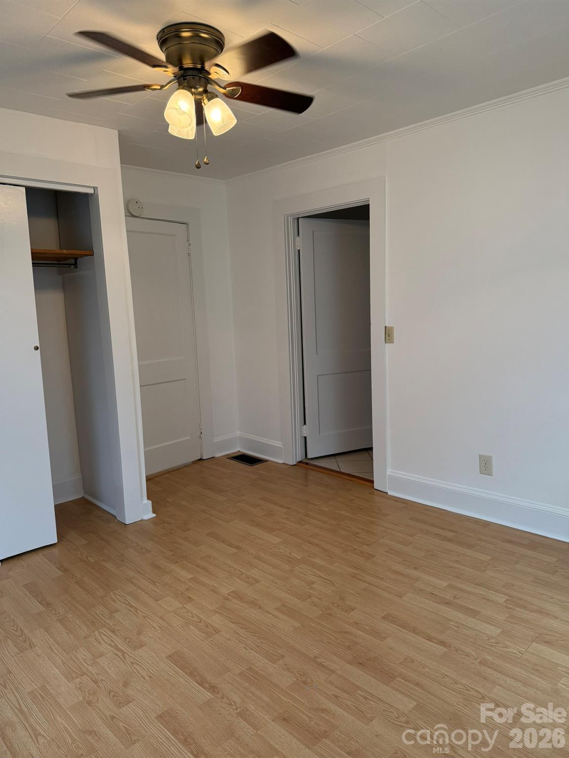108 Fletcher Street Morganton, NC 28655 - Photo 15 of 29 a view of an empty room with a ceiling fan