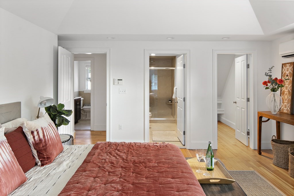 106 Florence Avenue Arlington, MA 02476 - Photo 17 of 32 a bedroom with furniture and a wooden floor