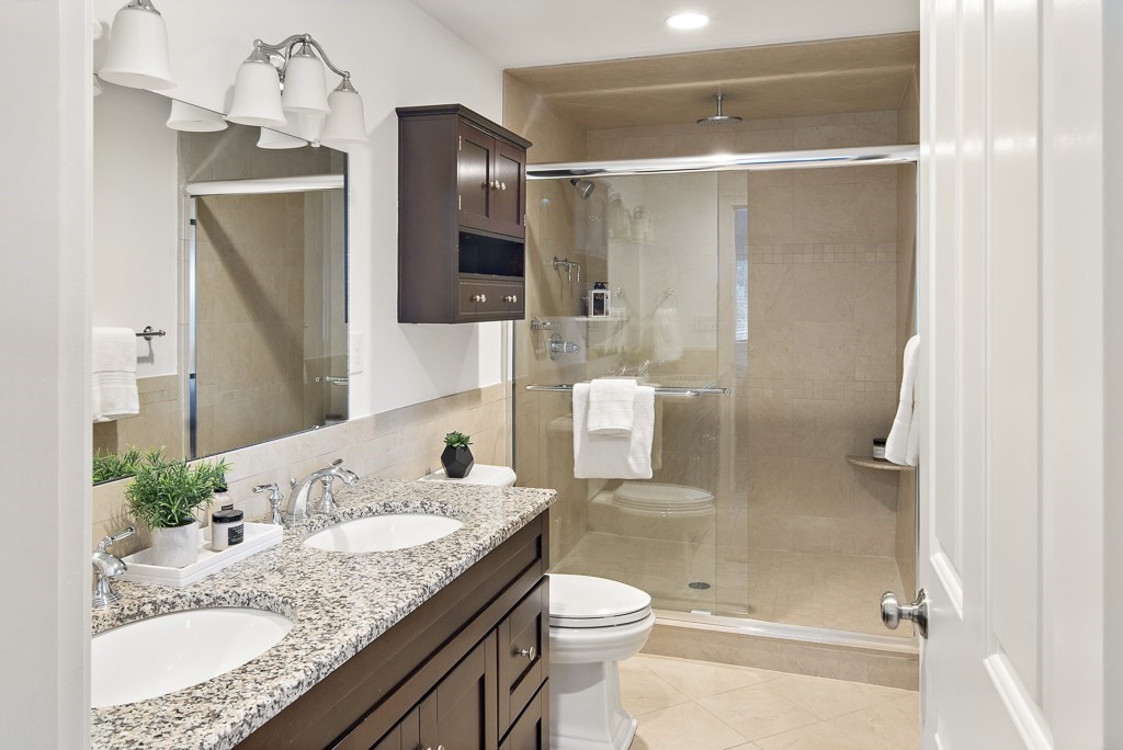 106 Florence Avenue Arlington, MA 02476 - Photo 18 of 32 a bathroom with a granite countertop sink toilet and shower