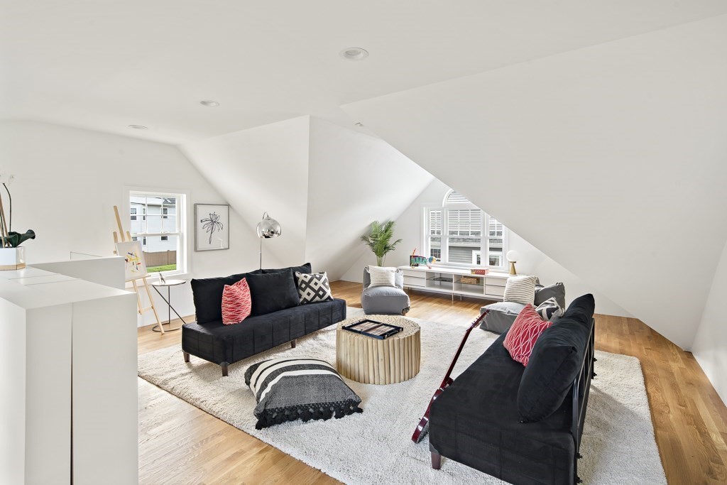 106 Florence Avenue Arlington, MA 02476 - Photo 31 of 32 a living room with furniture and a wooden floor