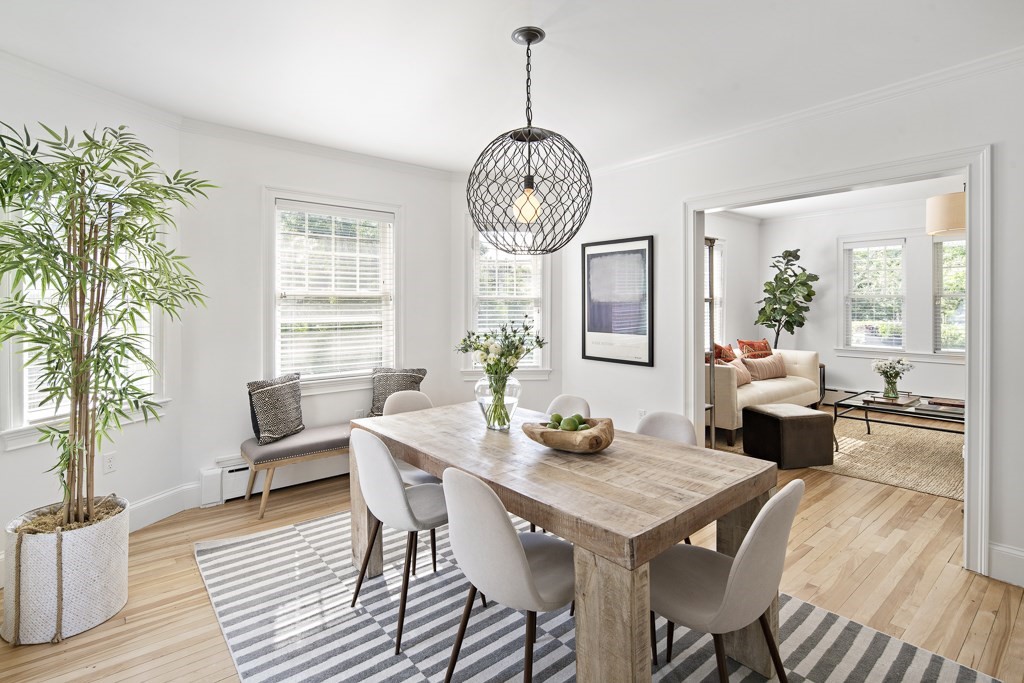 106 Florence Avenue Arlington, MA 02476 - Photo 10 of 32 a dining room with furniture a chandelier and wooden floor