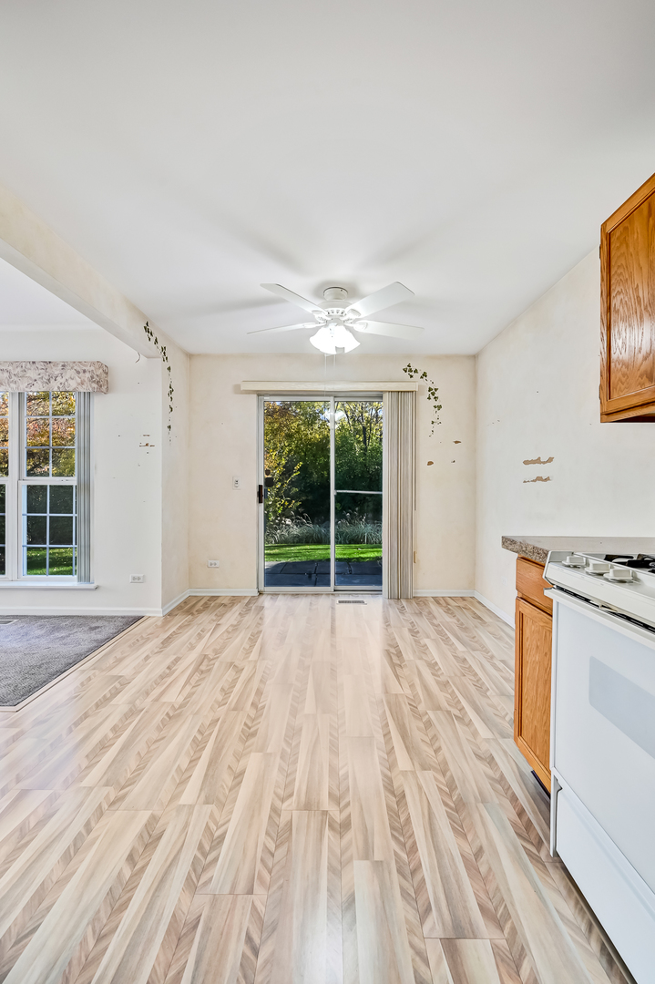 945 Willow Street Itasca, IL 60143 - Photo 11 of 19 a view of empty room with wooden floor and fan