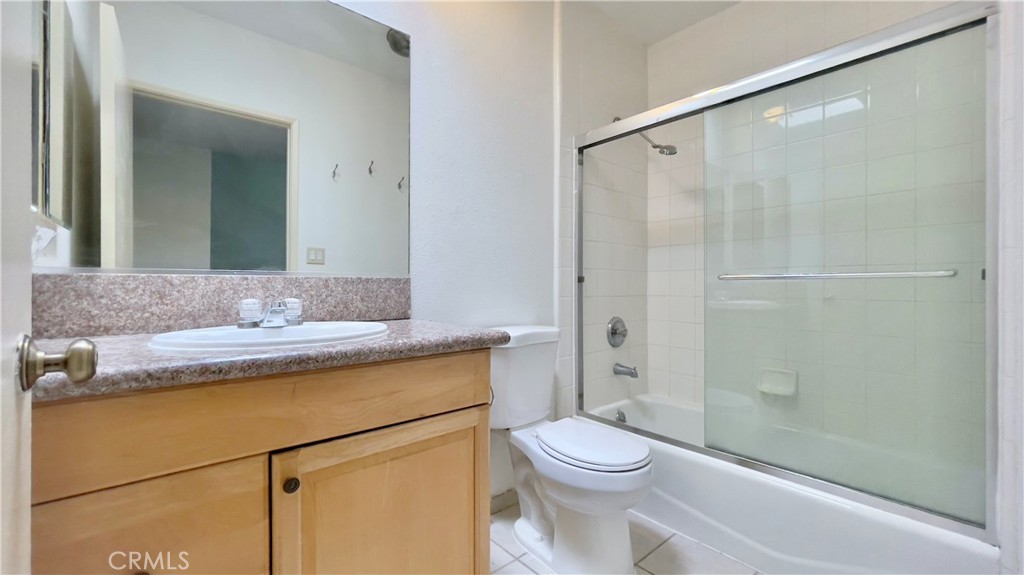 2911 4th Street, Unit 116 Santa Monica, CA 90405 - Photo 12 of 21 a bathroom with a granite countertop sink toilet and shower