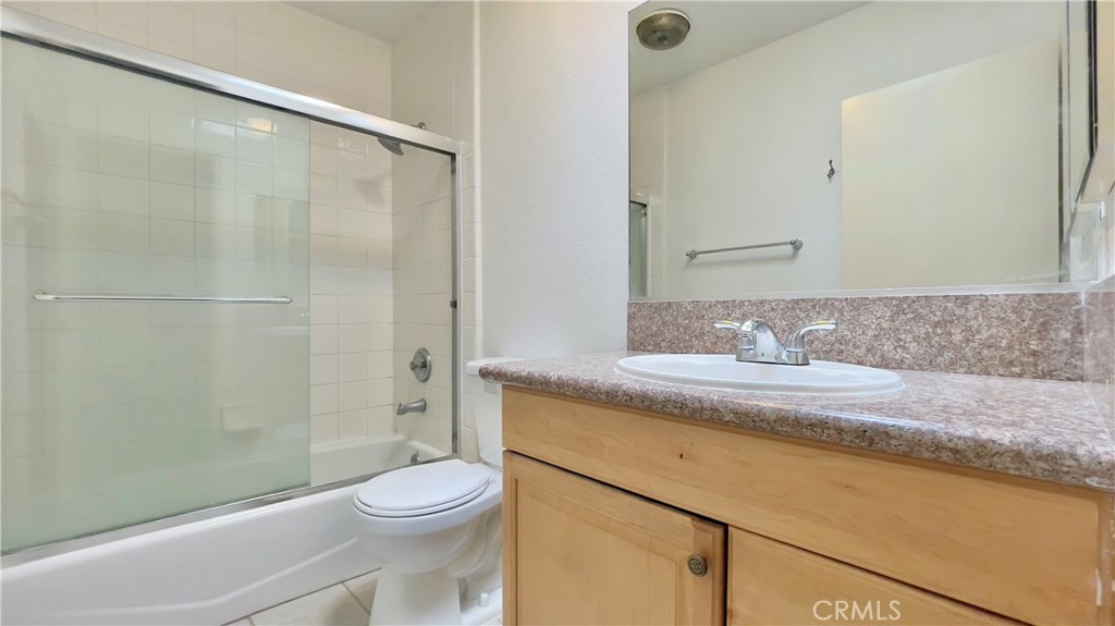 2911 4th Street, Unit 116 Santa Monica, CA 90405 - Photo 15 of 21 a bathroom with a granite countertop sink toilet and shower