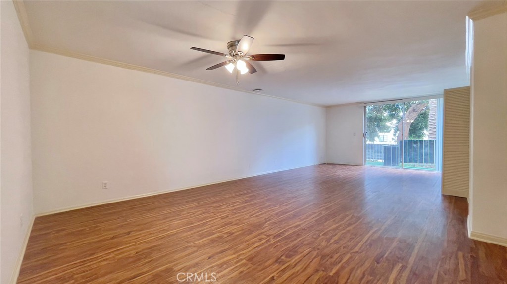 2911 4th Street, Unit 116 Santa Monica, CA 90405 - Photo 2 of 21 a view of an empty room with wooden floor and a window