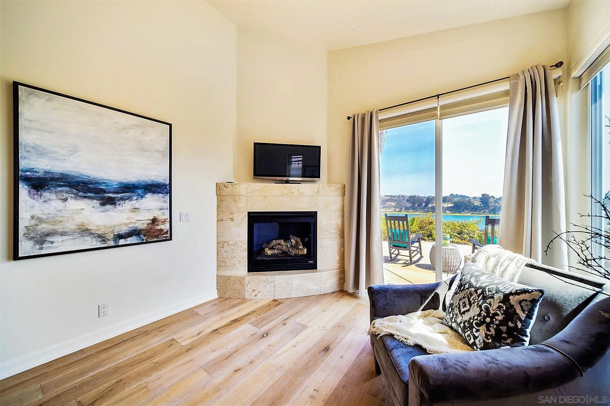 7558 Navigator Circle Carlsbad, CA 92011 - Photo 11 of 38 a living room with furniture and a fireplace