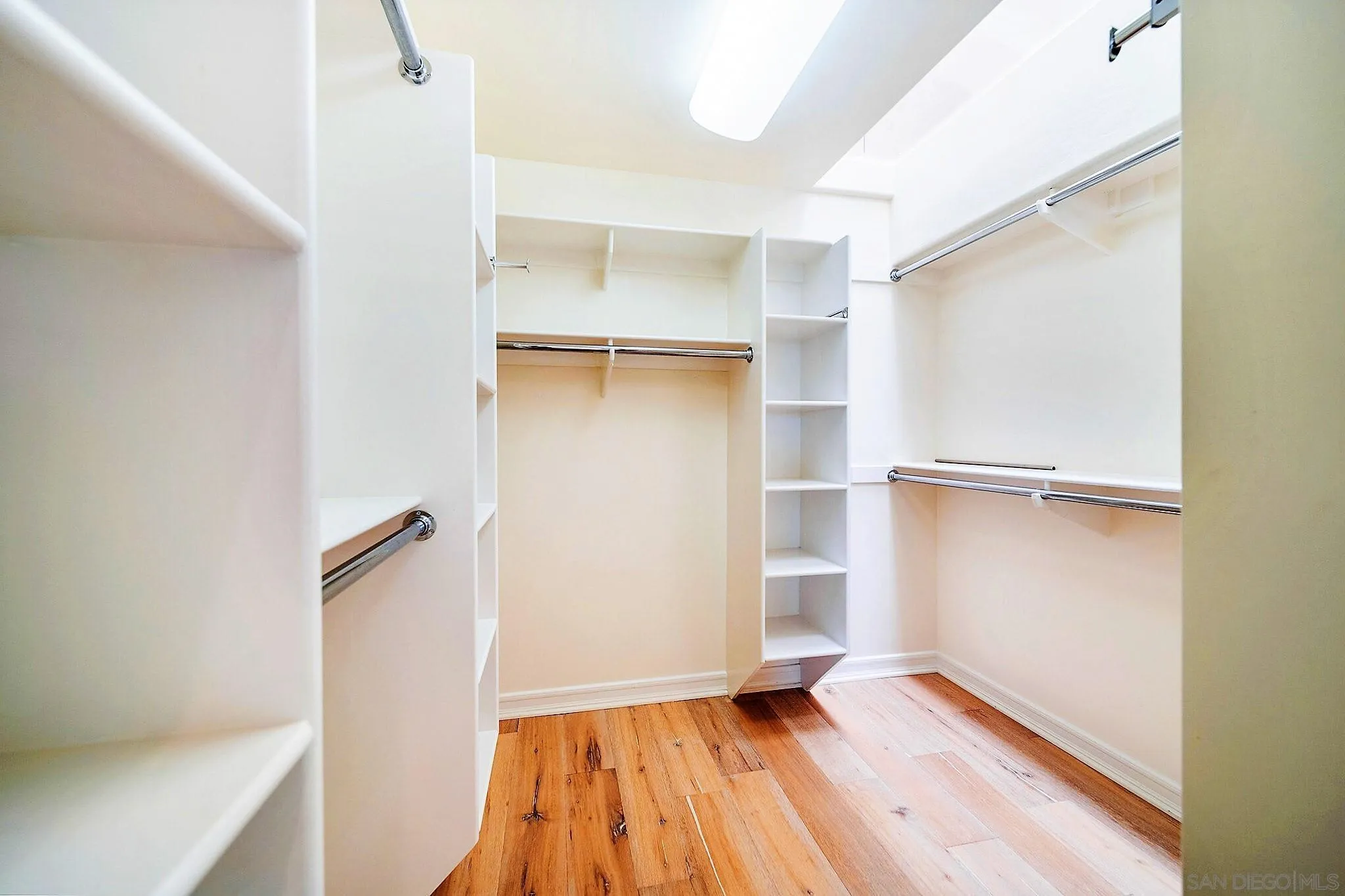 7558 Navigator Circle Carlsbad, CA 92011 - Photo 15 of 38 a view of an empty room with closet and a window