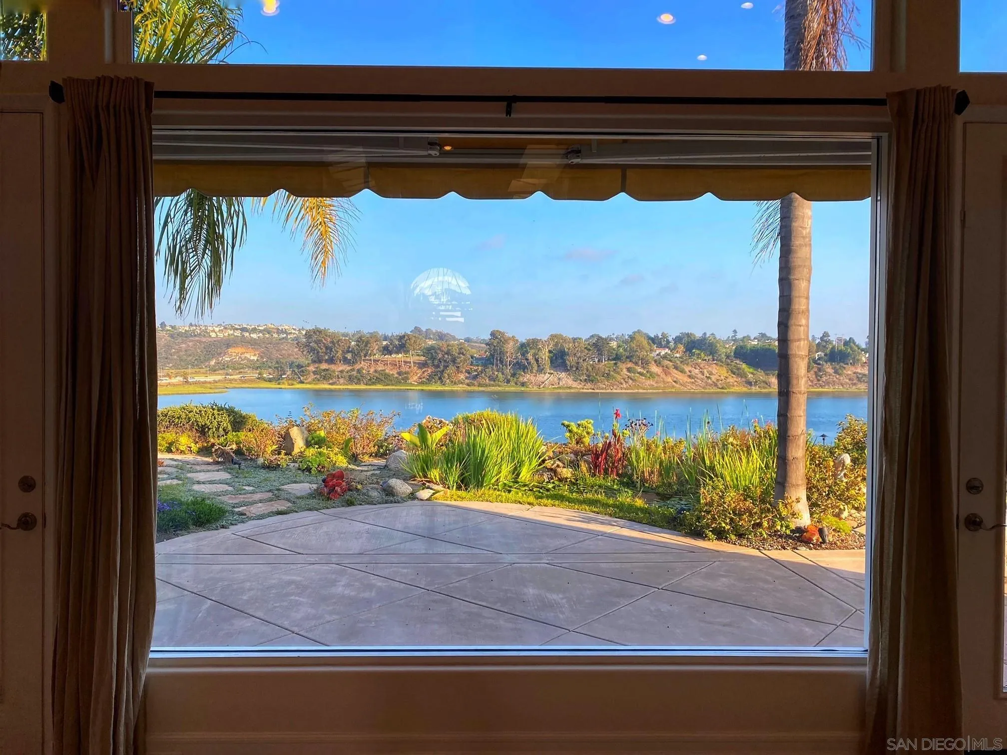 7558 Navigator Circle Carlsbad, CA 92011 - Photo 20 of 38 a view of a lake from a window
