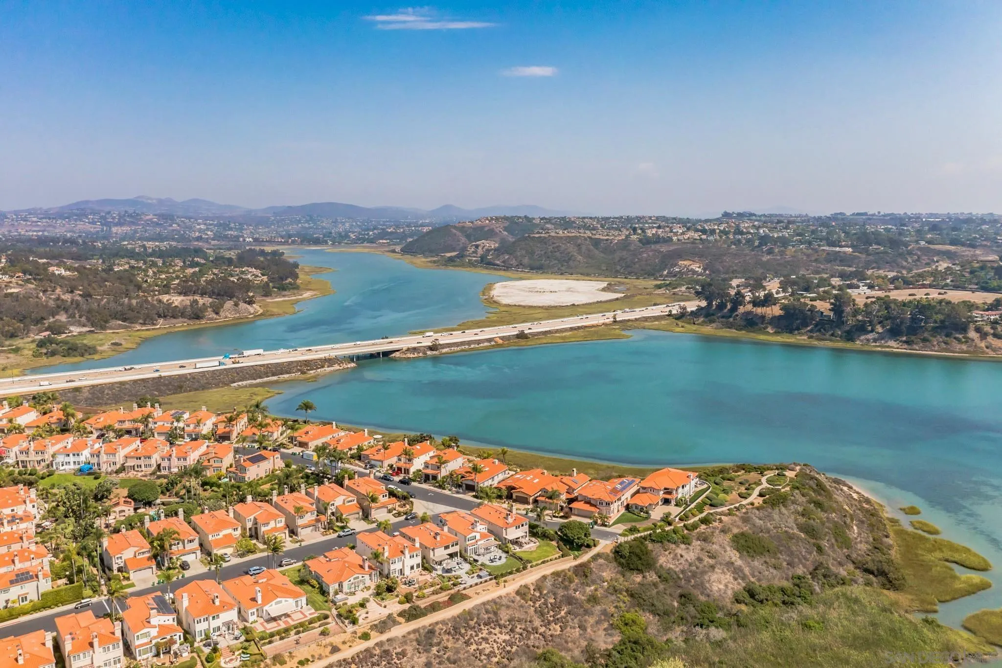 7558 Navigator Circle Carlsbad, CA 92011 - Photo 25 of 38 an aerial view of a house with a lake view