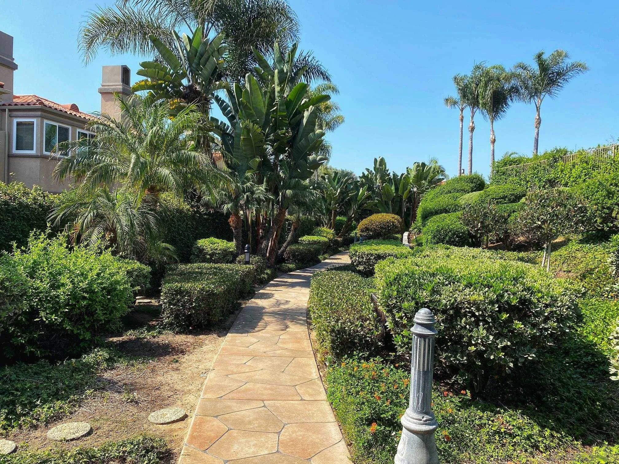 7558 Navigator Circle Carlsbad, CA 92011 - Photo 36 of 38 a view of a garden with a fountain