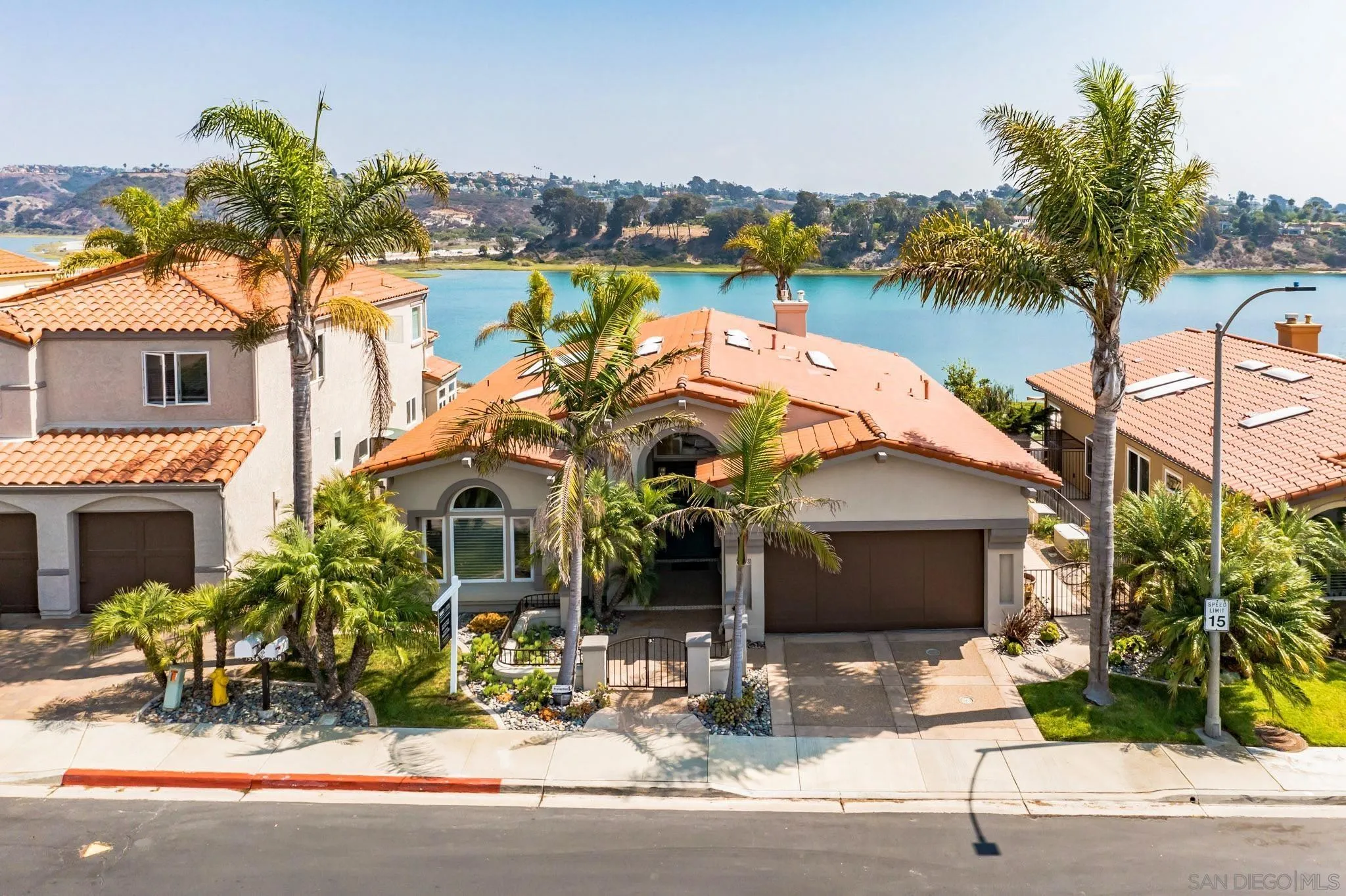 7558 Navigator Circle Carlsbad, CA 92011 - Photo 4 of 38 a view of a house with a garden and plants