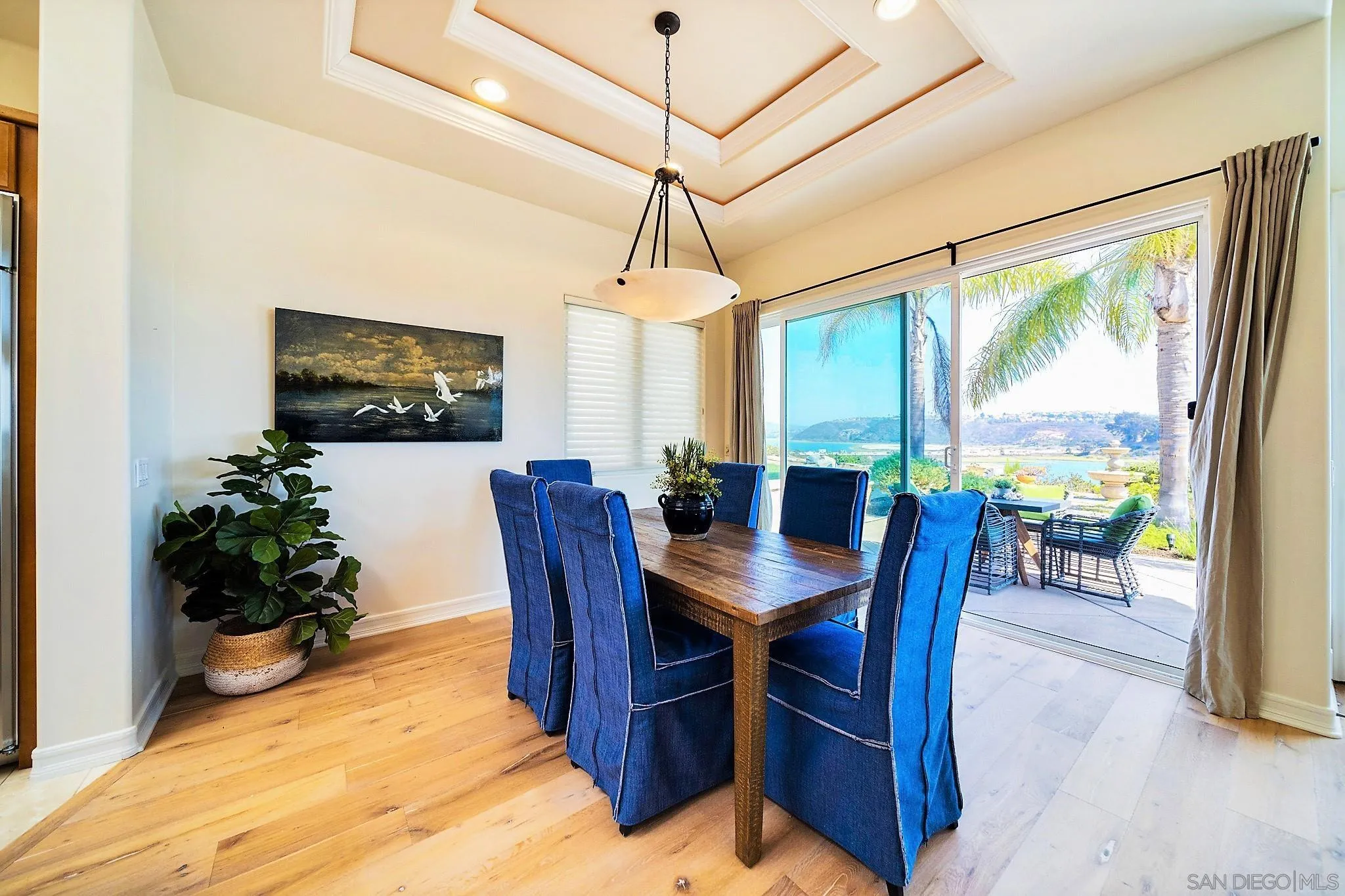 7558 Navigator Circle Carlsbad, CA 92011 - Photo 8 of 38 a view of a dining room with furniture window and wooden floor