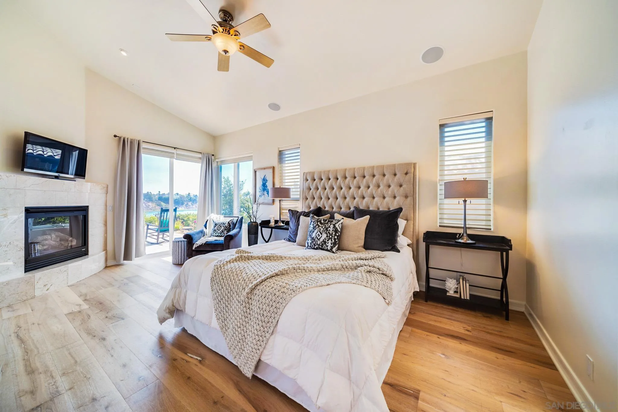 7558 Navigator Circle Carlsbad, CA 92011 - Photo 10 of 38 a bedroom with a bed and a fireplace