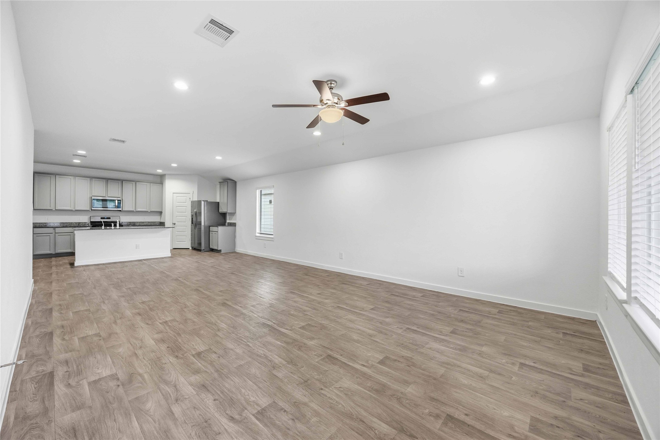 31627 Featherstone Trail Fulshear, TX 77441 - Photo 11 of 29 a view of a kitchen with a sink and a stove top oven