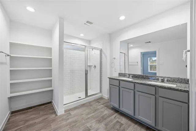 a bathroom with a granite countertop sink mirror and double