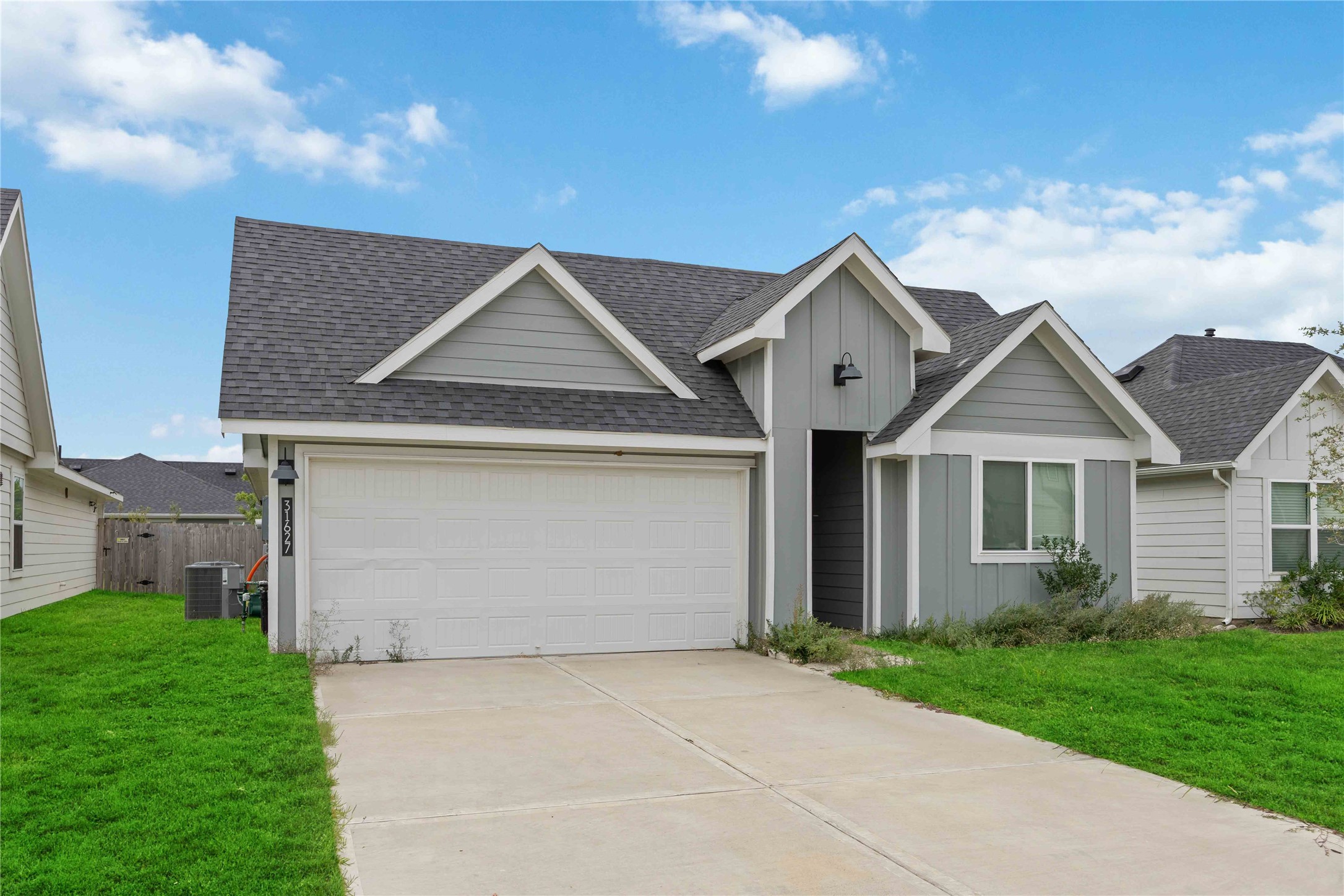 31627 Featherstone Trail Fulshear, TX 77441 - Photo 2 of 29 a front view of house with yard and garage
