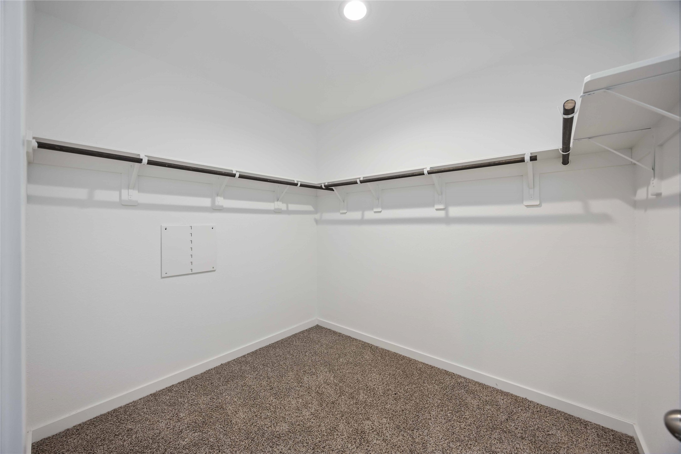 31627 Featherstone Trail Fulshear, TX 77441 - Photo 25 of 29 a view of a room with racks on the wall