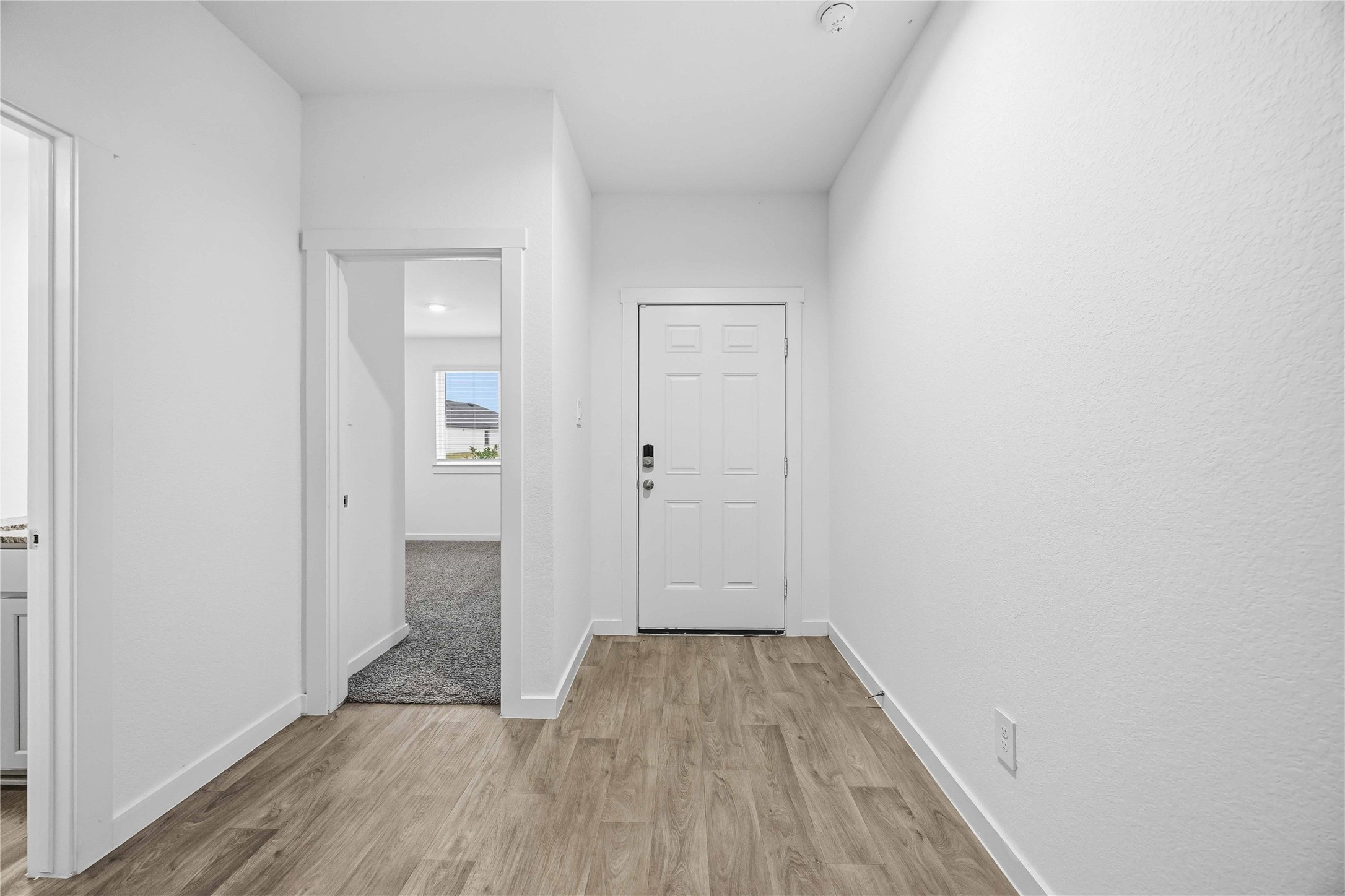 31627 Featherstone Trail Fulshear, TX 77441 - Photo 3 of 29 a view of a hallway with wooden floor