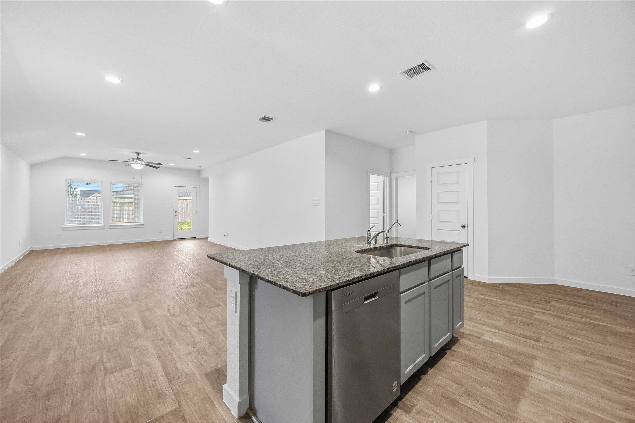 31627 Featherstone Trail Fulshear, TX 77441 - Photo 7 of 29 a kitchen with a sink and a stove top oven