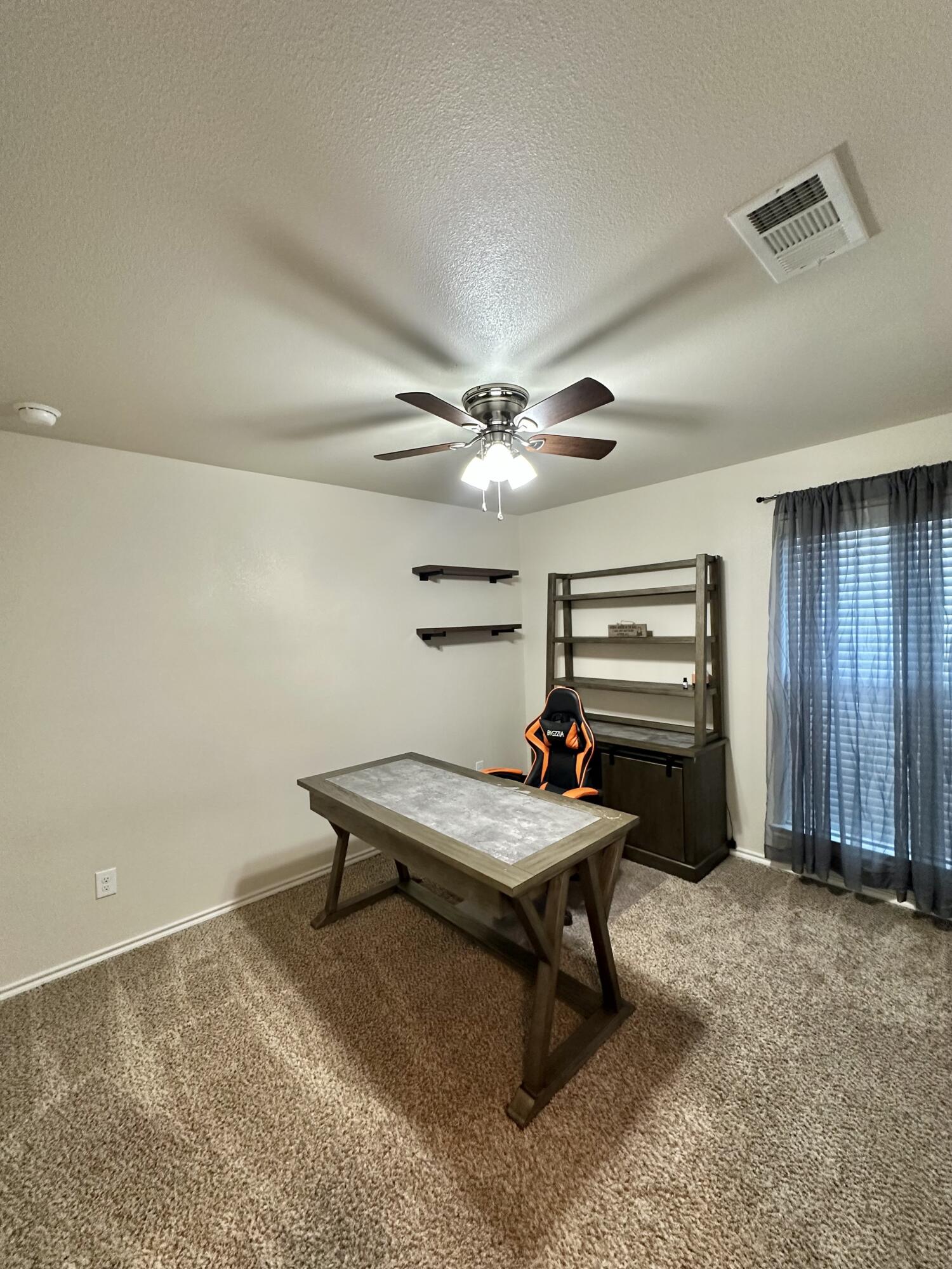 10411 Valencia Avenue Lubbock, TX 79424 - Photo 13 of 16 a room with furniture pool table and window