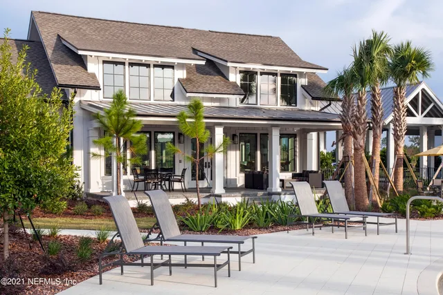 a view of a city with lots of residential buildings lake and ocean view