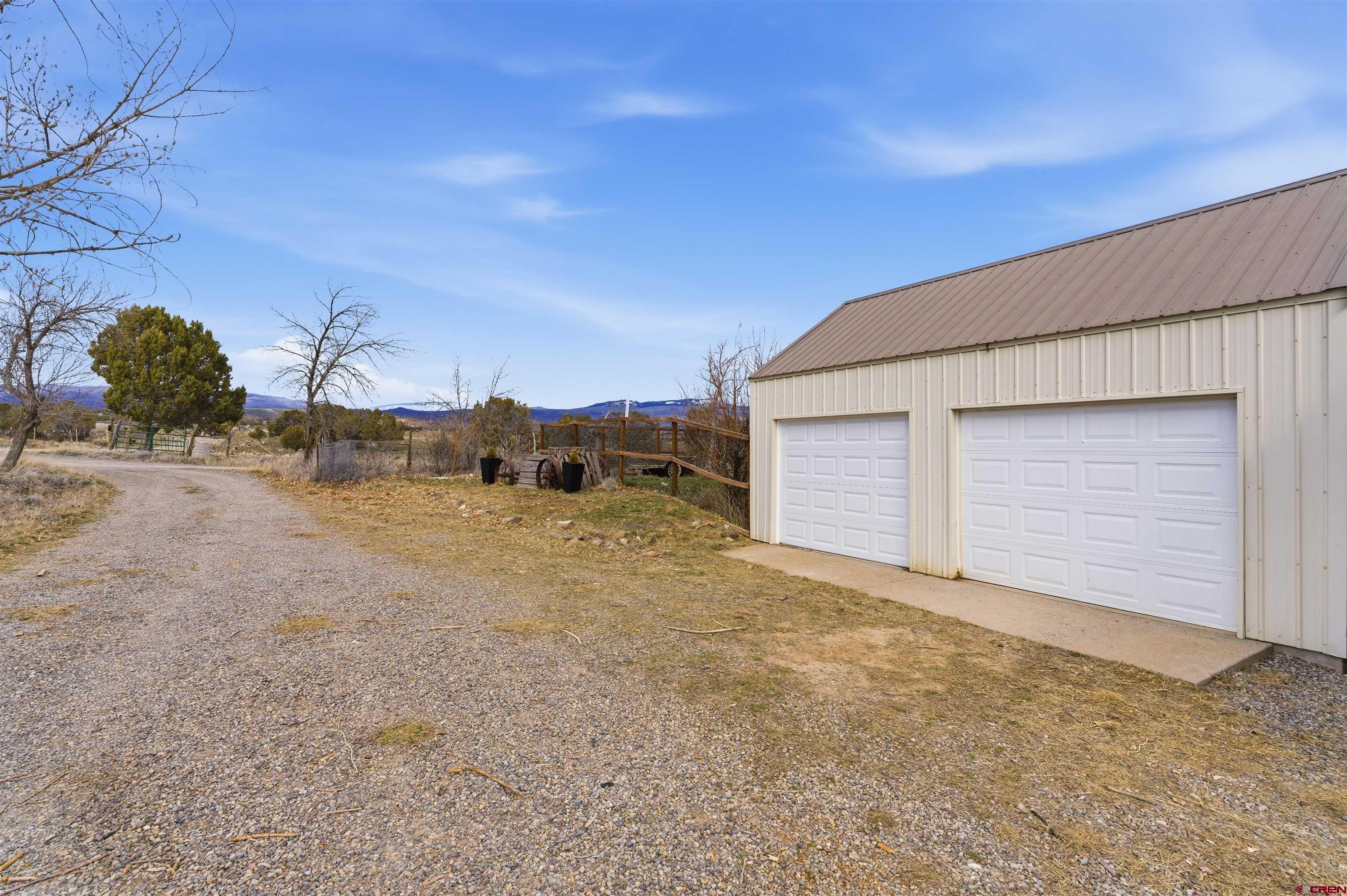 16216 2600th Road Cedaredge, CO 81413 - Photo 37 of 45 a view of a house with a yard