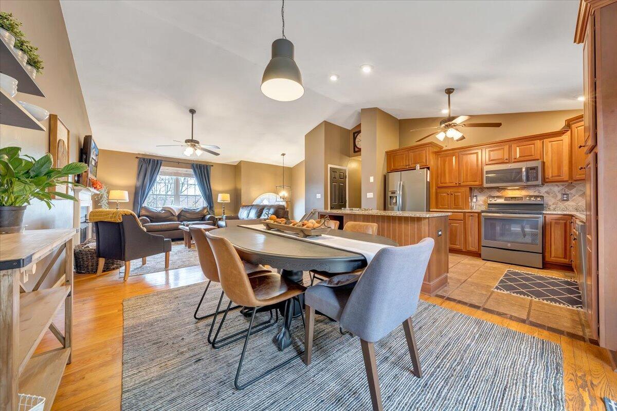 1748 Meadows Road Vinton, VA 24179 - Photo 11 of 34 a dining area with a table chairs and a kitchen view