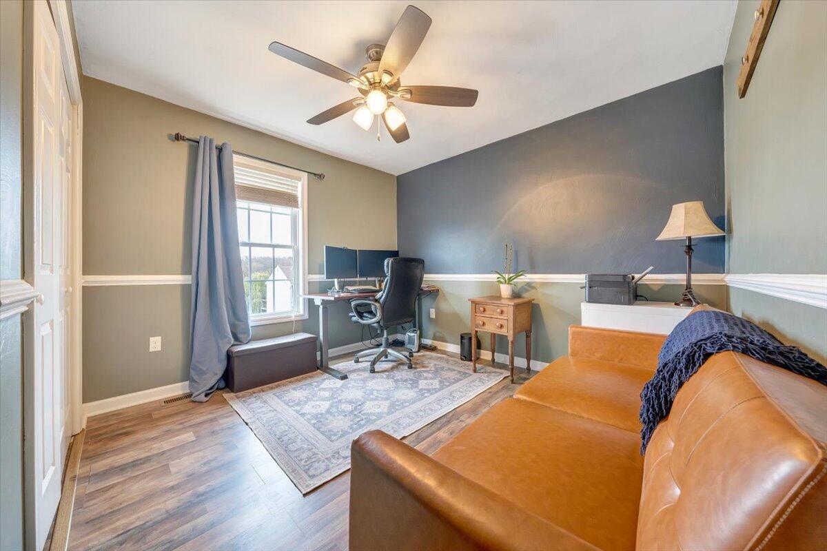 1748 Meadows Road Vinton, VA 24179 - Photo 19 of 34 a bedroom with a bed and wooden floor