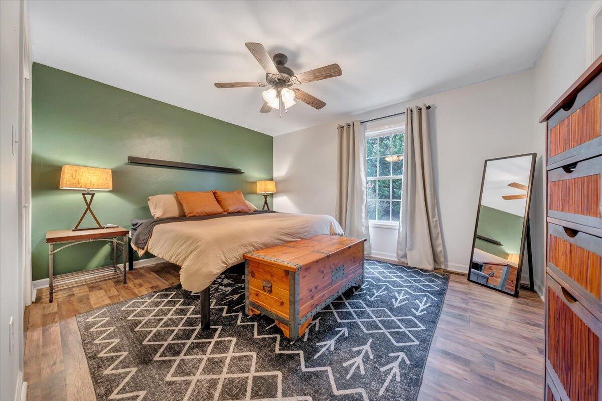 1748 Meadows Road Vinton, VA 24179 - Photo 20 of 34 a bedroom with a bed and a mirror on the dresser
