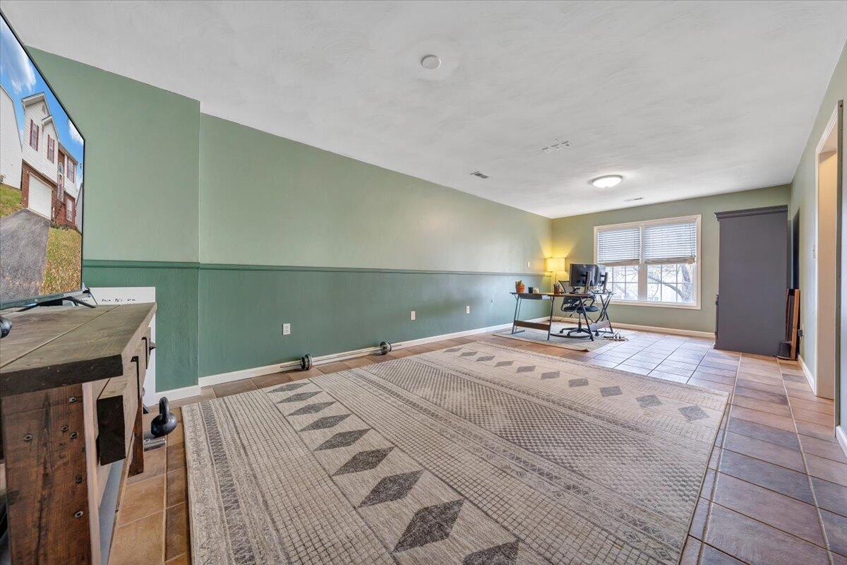 1748 Meadows Road Vinton, VA 24179 - Photo 24 of 34 a bedroom with a bed and wooden floor