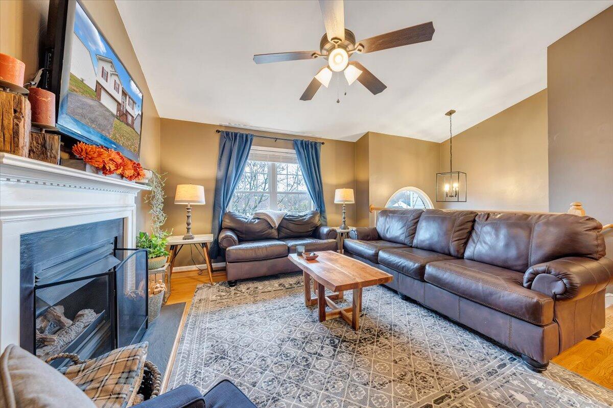 1748 Meadows Road Vinton, VA 24179 - Photo 6 of 34 a living room with furniture a fireplace and a large window