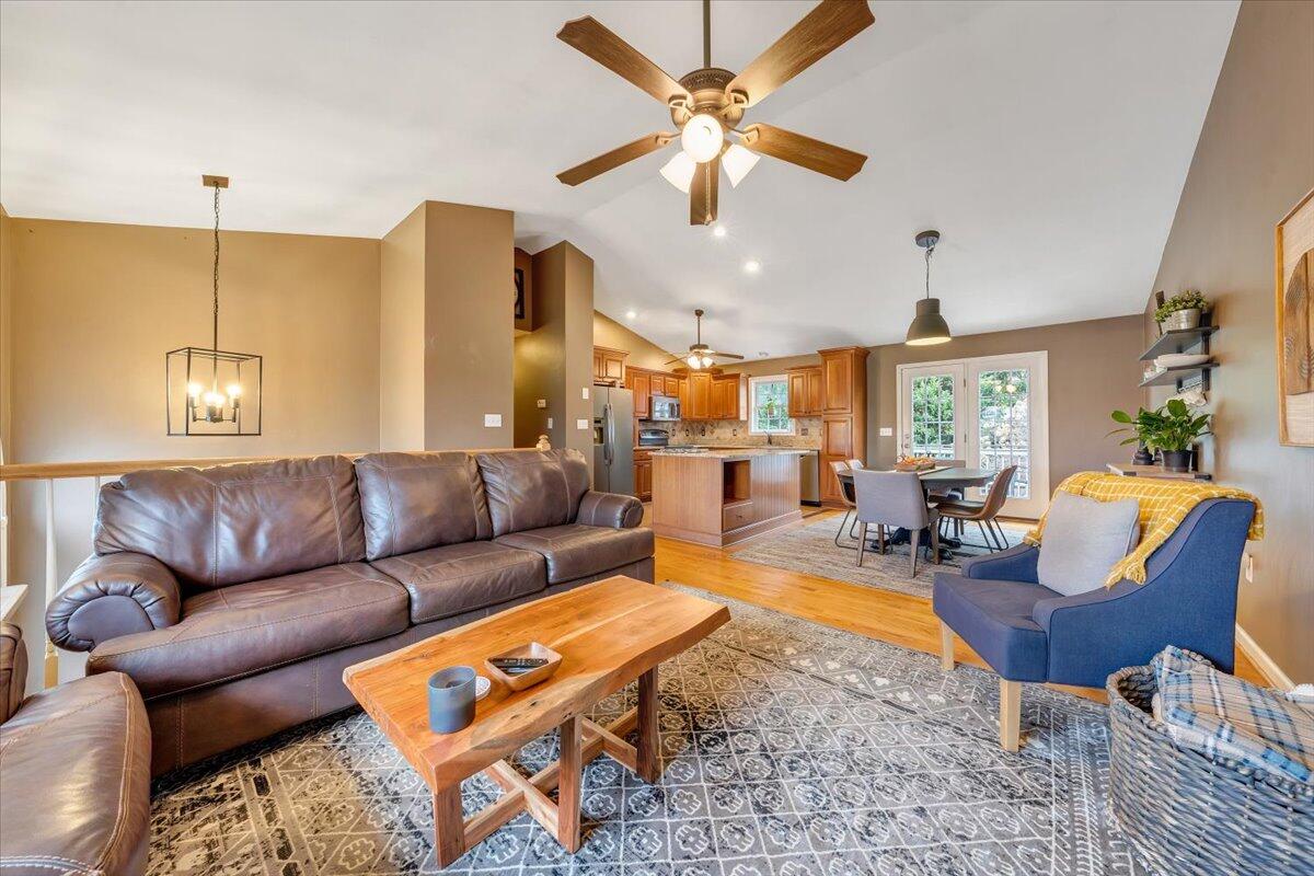 1748 Meadows Road Vinton, VA 24179 - Photo 8 of 34 a living room with furniture kitchen view and a chandelier