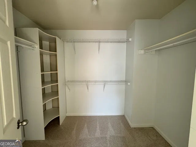 a view of an empty walk in closet