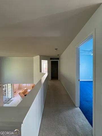 a view of entryway and kitchen