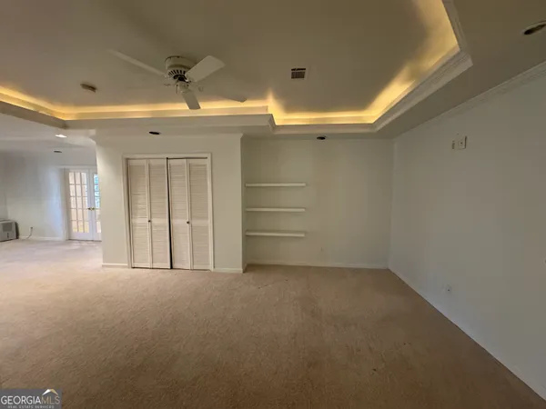 a view of an empty room with a window