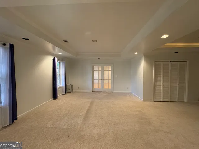 a view of an empty room with a window
