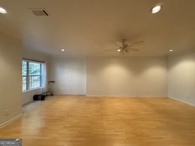 a view of a hallway with wooden shelves