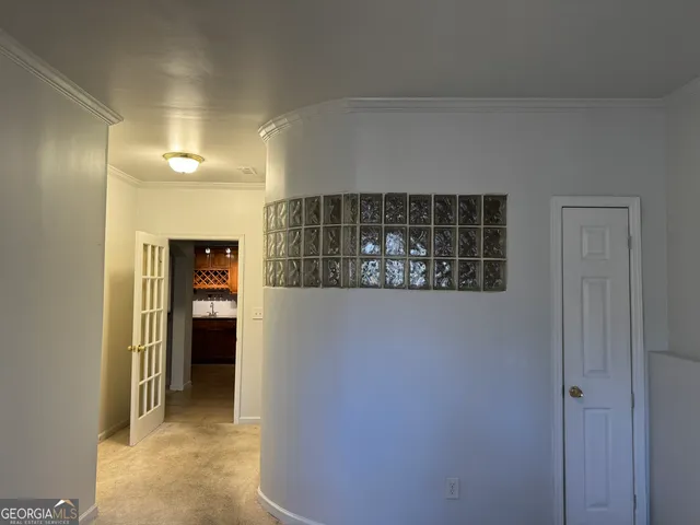 a view of kitchen with granite countertop cabinets and sink