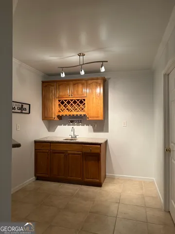 a view of a porch with wooden floor and fence