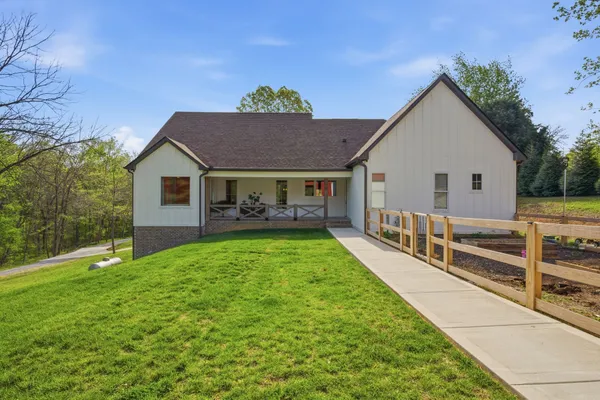 a front view of house with garden