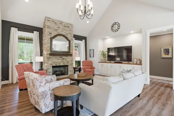 a living room with furniture and a fireplace