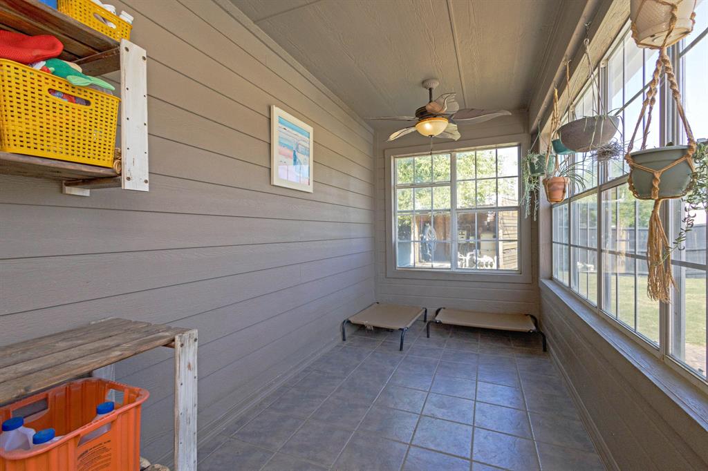 13508 Deussen Road Ponder, TX 76259 - Photo 20 of 40 a room with window and a chandelier