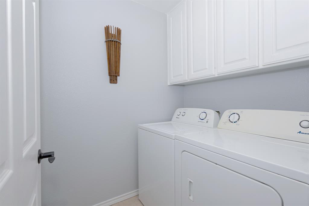 13508 Deussen Road Ponder, TX 76259 - Photo 21 of 40 a utility room with dryer and washer