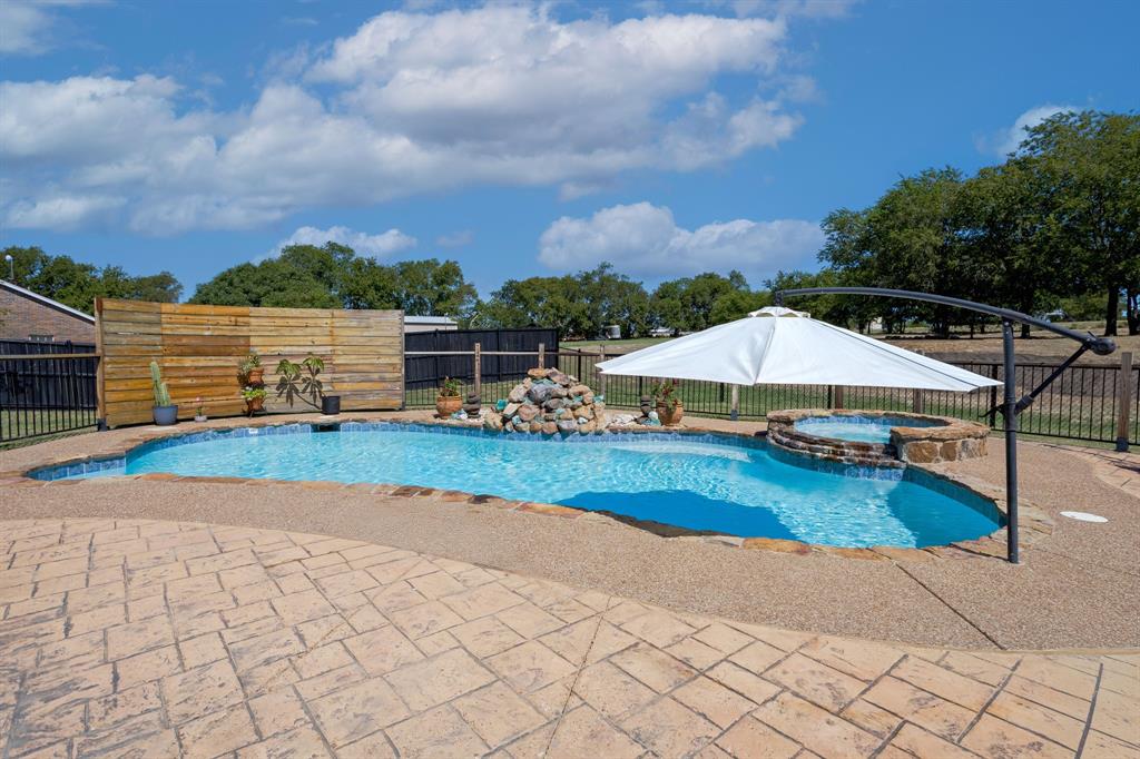 13508 Deussen Road Ponder, TX 76259 - Photo 35 of 40 a view of a swimming pool with lounge chairs
