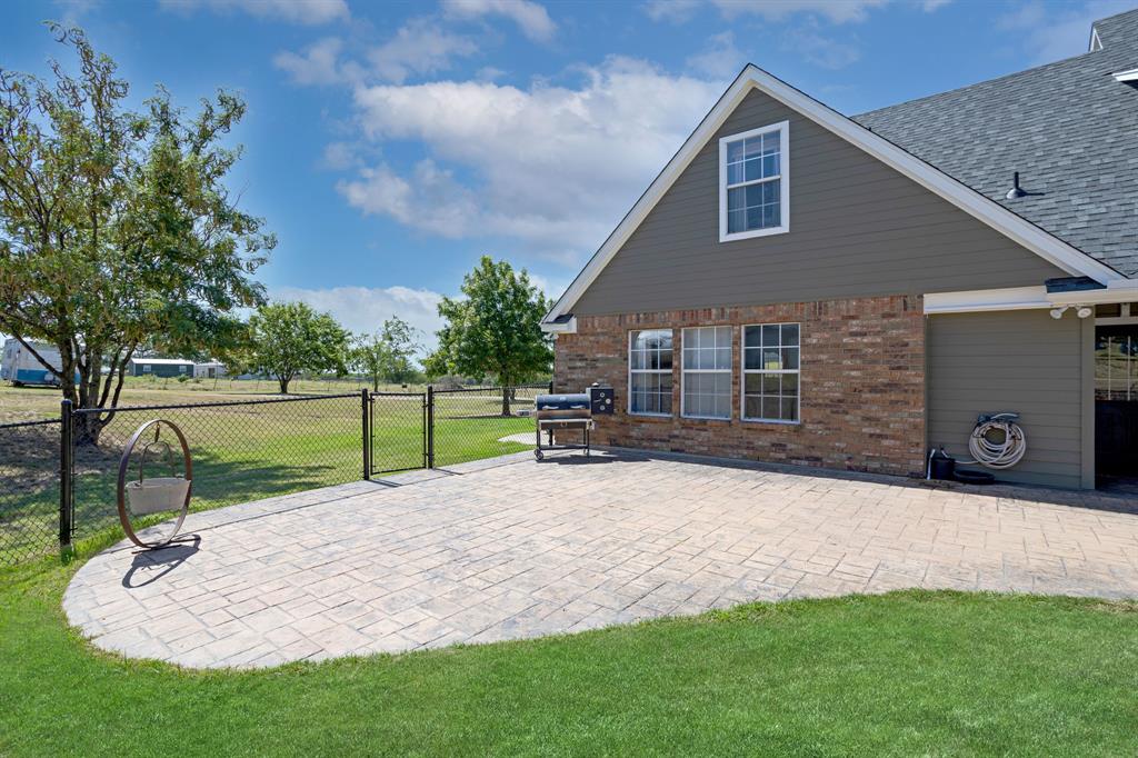 13508 Deussen Road Ponder, TX 76259 - Photo 36 of 40 a view of a house with backyard and a tree