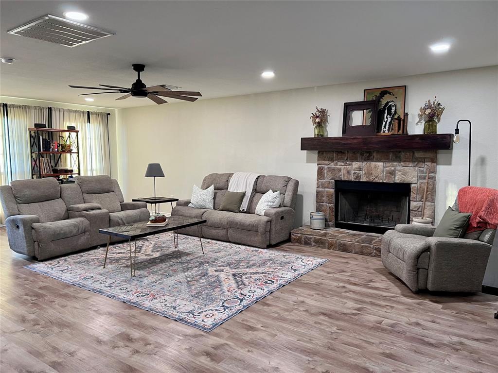 13508 Deussen Road Ponder, TX 76259 - Photo 6 of 40 a living room with furniture and a fireplace