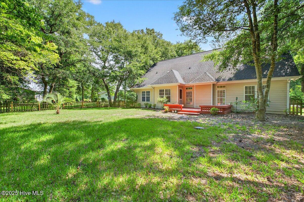 8985 Woodbine Road Southwest Sunset Beach, NC 28468 - Photo 53 of 65 View of spacious backyard