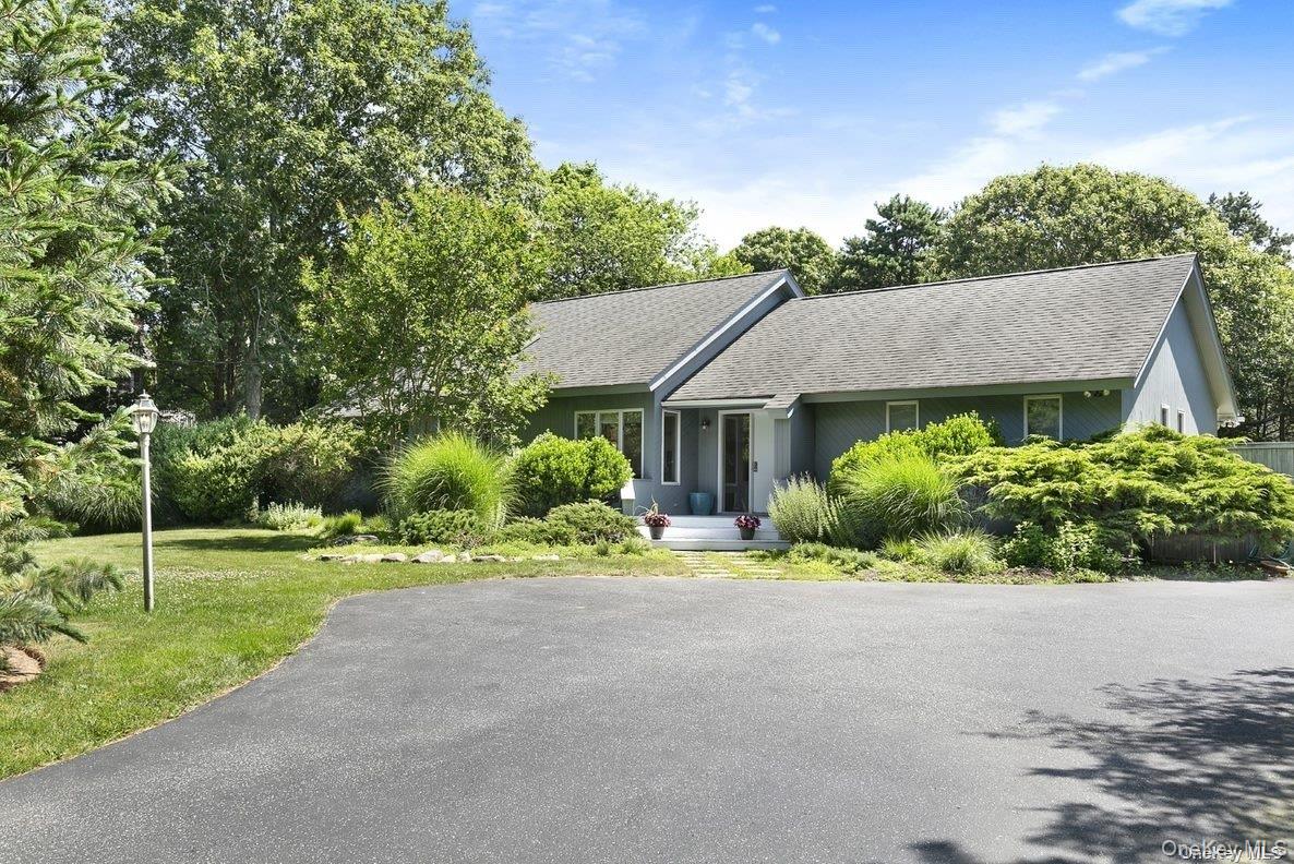 70 Jagger Lane Westhampton, NY 11977 - Photo 2 of 20 a aerial view of a house with a yard and potted plants